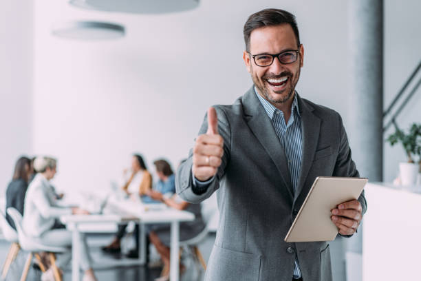 istock Confident businessman and his team. 2103894527