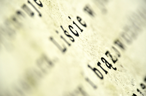 a close-up of text, specifically the letters, 
with blurred, highlighting the effects of selective focus and depth of field