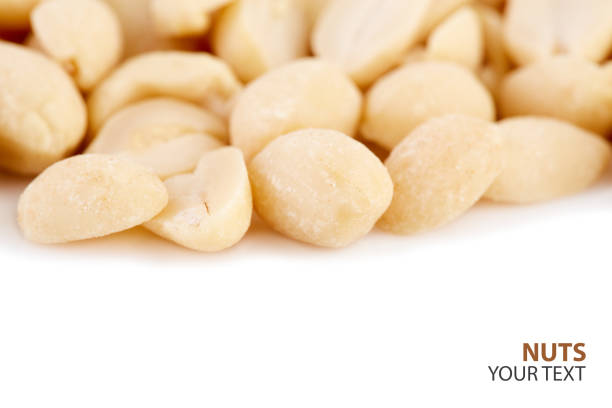 Peeled peanuts on a white background. Healthy food. Nuts.