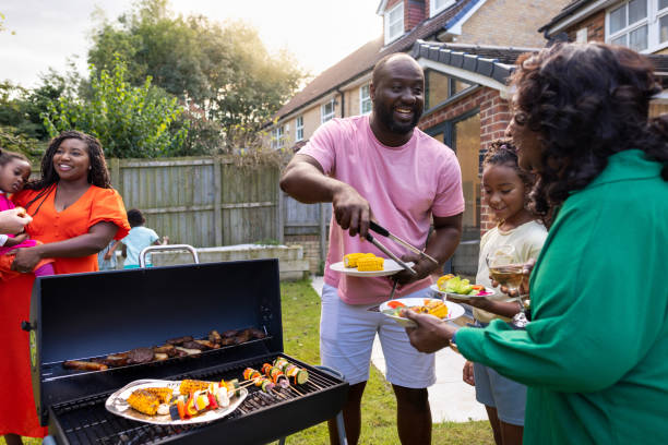 BBQ in The Sun with Family and Friends An over-the-shoulder shot of a male adult serving freshly prepared BBQ food to his family. They are all wearing casual clothing and enjoying freshly prepared food. The house is located in Newcastle Upon Tyne, England.
Videos are available similar to this scenario bbq stock pictures, royalty-free photos & images