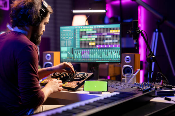 istock Music producer watching tutorial online and learning to mix sounds 2103958864
