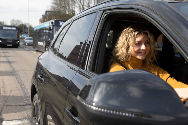 istock Woman driver in a car in traffic 2103964507