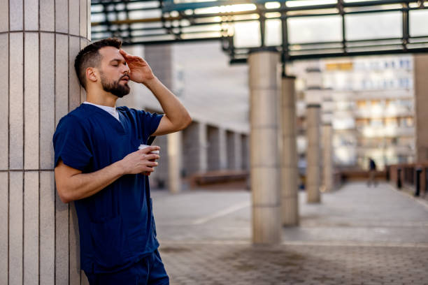 istock Healthcare worker having stressful job, feeling exhausted. 2103971992