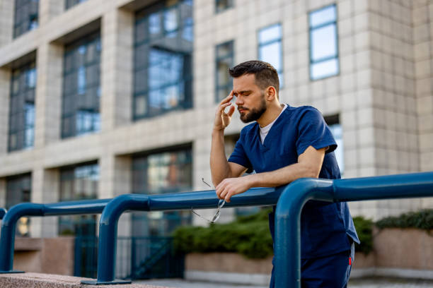 istock Healthcare worker having stressful job, feeling exhausted. 2103985311