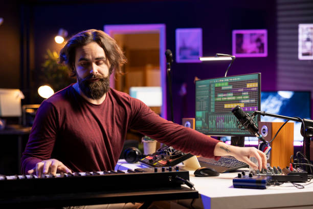 istock Audio engineer mixing and mastering soundtracks in home studio 2103987400