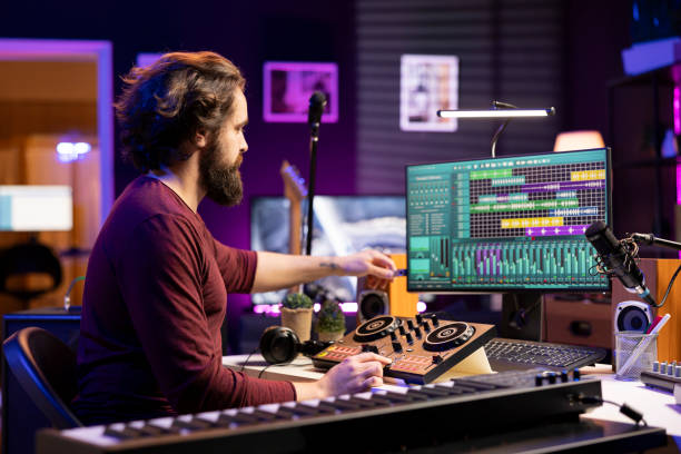 istock Music producer creating new music with an usb stick in home studio 2103991042
