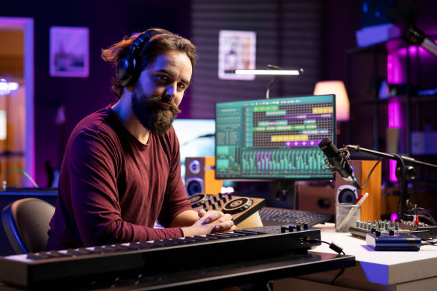 istock Portrait of artist producer playing midi controller notes 2103993653