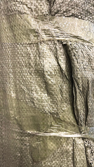Woven Texture Detail: A Close-Up View Of A Woven Textile Showing Intricate Patterns And Folds. The Material Displays A Subtle Shimmer And Complex Weaving Technique