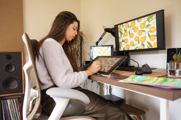 istock Graphic Designer Drawing Lemons at Home 2104006968