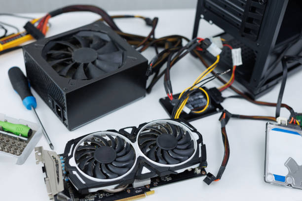 istock Top view of computer parts with hard drive RAM CPU graphics card hard disk drive motherboard fan. 2104019263