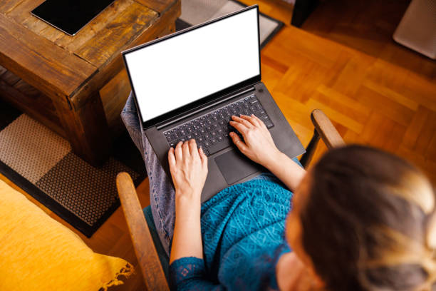 istock Laptop with white screen in woman's lap 2104019776
