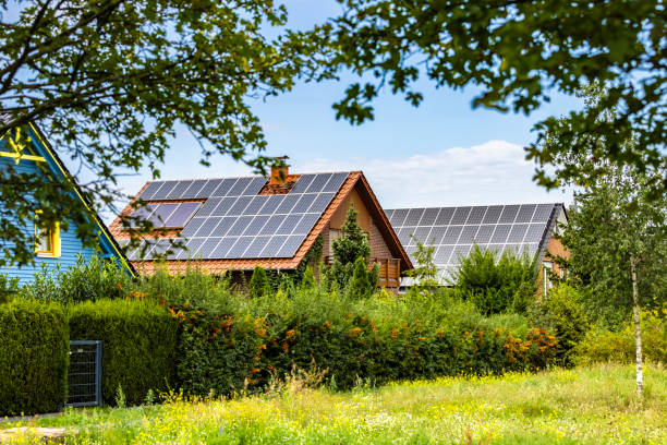istock Houses with solar panels on a summer day 2104048105