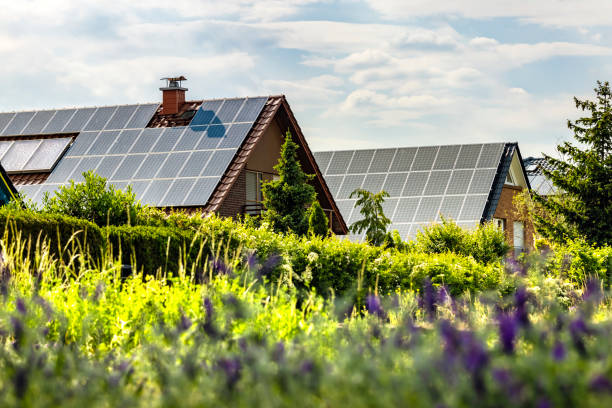 istock Houses with solar panels on a summer day 2104048109