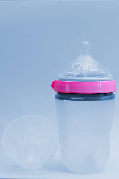 Baby bottle, empty isolated on white background. Studio shot.