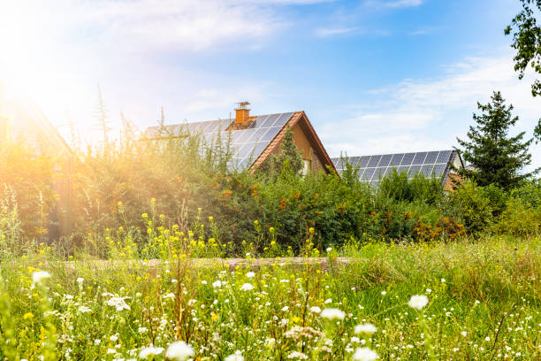 istock Houses with solar panels on a summer day 2104065920