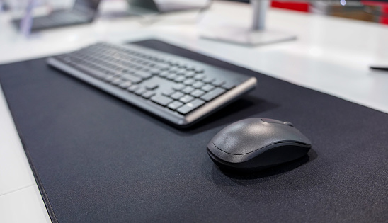 Computer mouse and keyboard on a mouse pad. Technology and IT concept. Gaming.