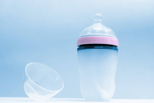 Baby bottle for feeding newborn babies on a blue background