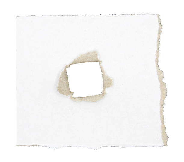 istock A piece of paper is torn with a hole isolated on white background 2104131645