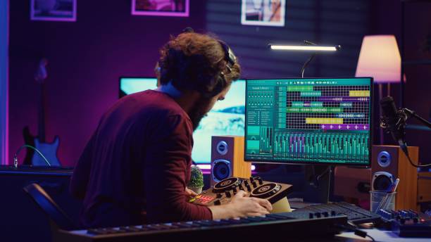 istock Sound engineer synchronizing video and audio tracks in his home studio 2104132174