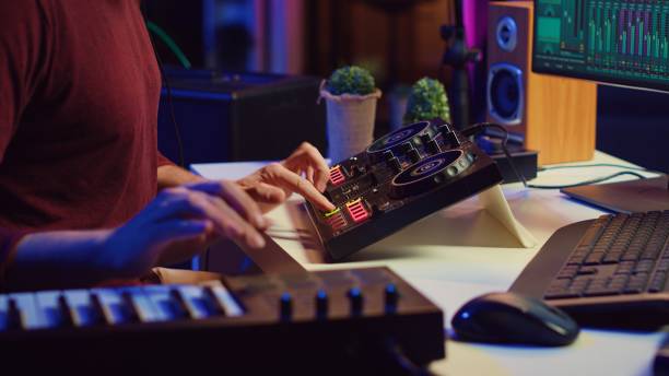 istock Audio engineer working with soundboard to create the perfect sounds 2104133750