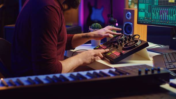istock Audio engineer recording piano keyboard instrument notes and vocals 2104151603