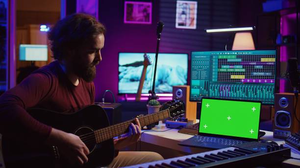 istock Musician beginner learning accords to play acoustic guitar 2104154763
