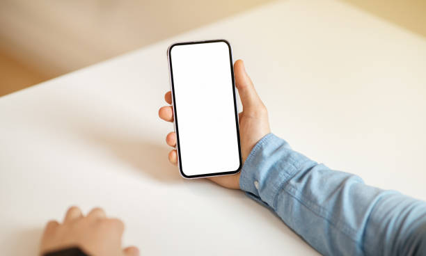 istock Young european man hand hold smartphone with empty screen, work 2104172687