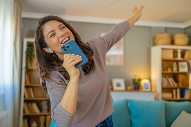 istock Happy attractive brunette woman having fun at home 2104178472