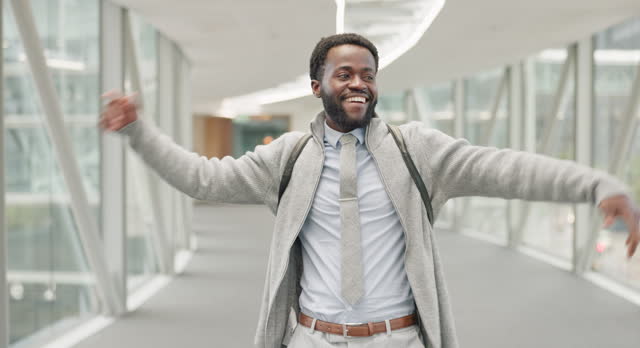 Happy, businessman and excited walk, cheerful and smile for promotion in work lobby. Professional, successful and winning black male person for new opportunity, employee celebrating bonus victory