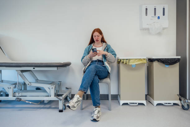 istock Patient on Phone in Hospital 2104199661
