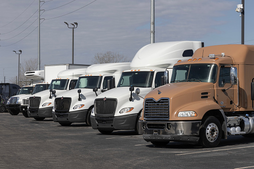 Indianapolis - March 20, 2024: Used Mack, International and Freightliner Big Rig Trucks for sale. Pre-owned semi tractor trailer trucks are in high demand.