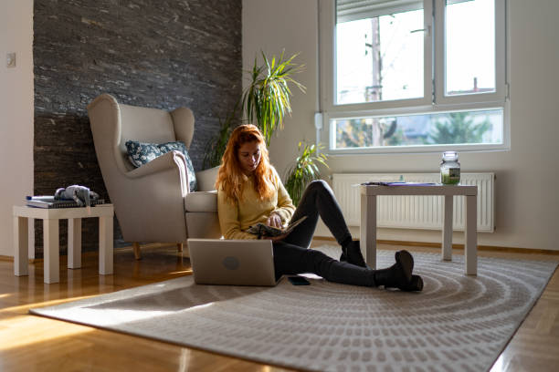 istock Woman using laptop at home 2104220424