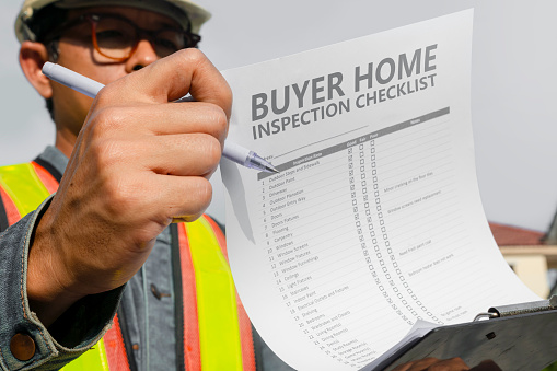 The home inspector or engineer checks the building structure and house construction specifications. After the renovation is complete