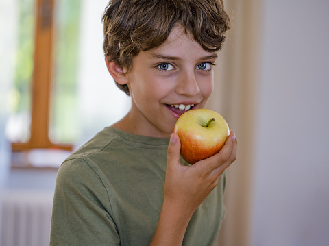 Young Boy with an Apple