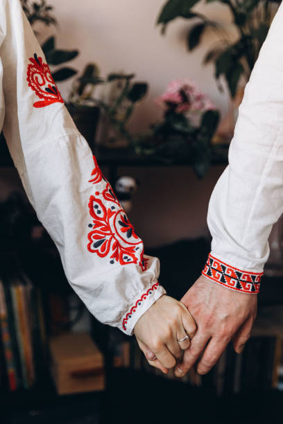 istock Embroidered Elegance: Hands in Traditional Ukrainian Vyshyvanka 2104262222