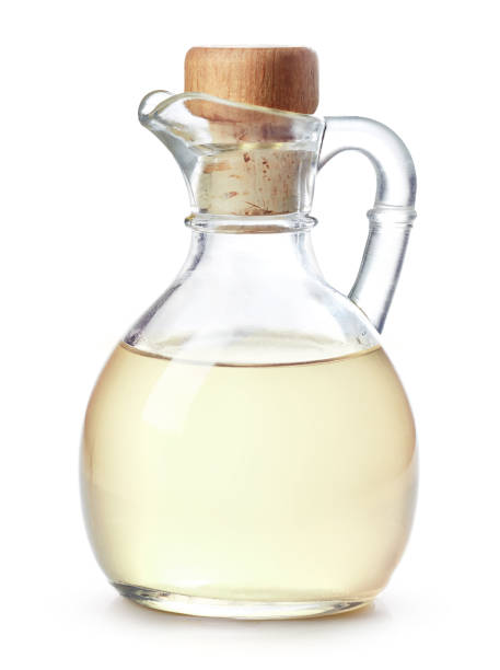 istock Bottle of coconut oil on white background 2104304452