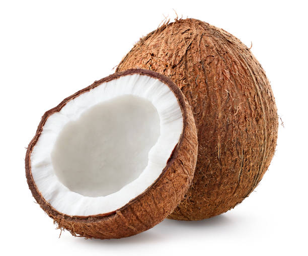 Whole and half of fresh ripe coconut isolated on white background