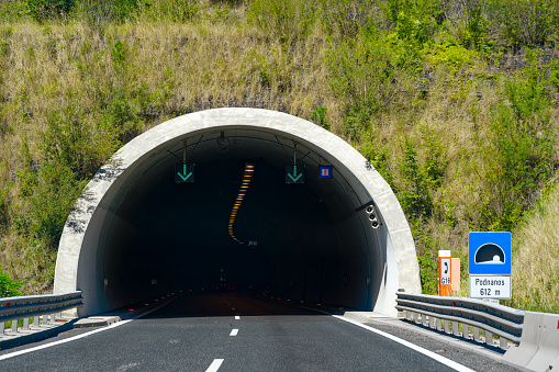 Slovenian highway with tunnel entrance near the Italian border on a sunny summer day. Photo taken August 11th, 2023, Slovenia.
