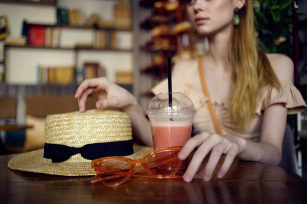 beautiful woman reading a book in a cafe communication. High quality photo