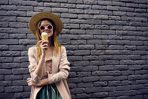 pretty woman on the street with ice cream vacation model. High quality photo