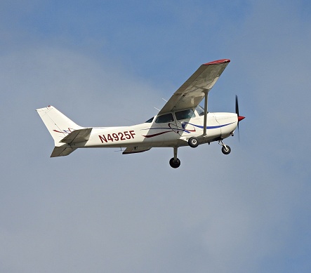 Boca Raton, Palm Beach County, Florida, USA, March 21, 2024.  A Cessna fixed wing single engine (4 seats / 1 engine)\nN4925F taking off from the Boca Raton Airport.