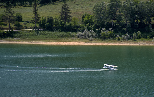 seaplane lands on the surface of Mercatale lake