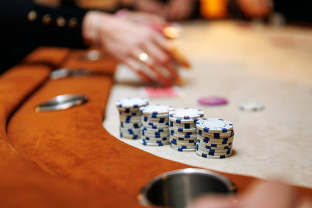 istock Stacked chips of a lucky player on a table in a casino. 2104402108