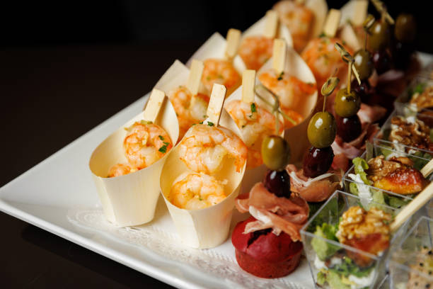 istock An elegant display of various appetizers on a white platter 2104402655