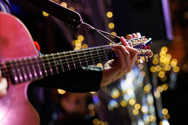 istock Musicians playing acoustic guitar, close up. 2104402662