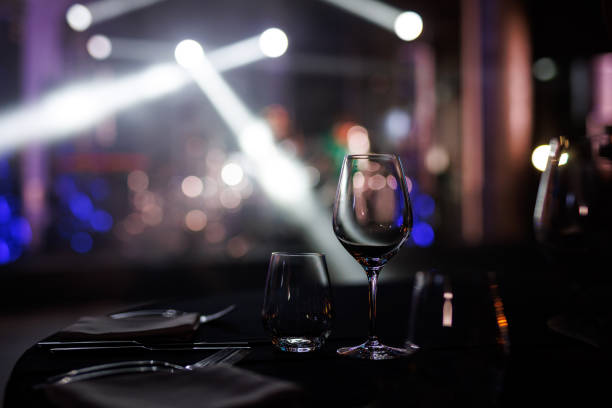 istock Served table in a restaurant at the holiday. Empty glasses before the event 2104402678