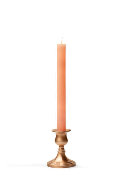 istock A copper chandelier with a pink candle on a white background with copy space 2104421885
