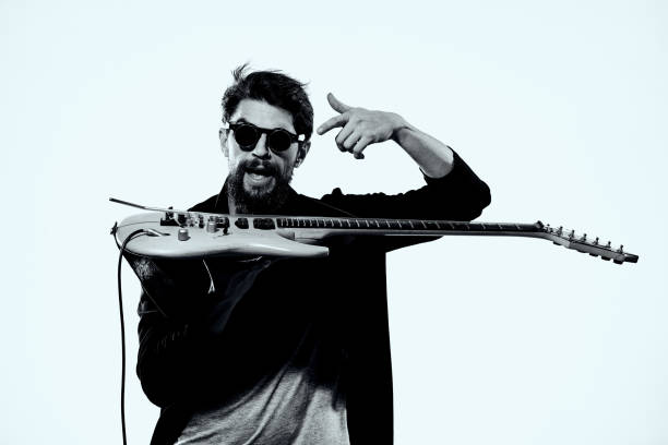 istock Man with guitar music performance entertainment contemporary performer sunglasses studio 2104446281