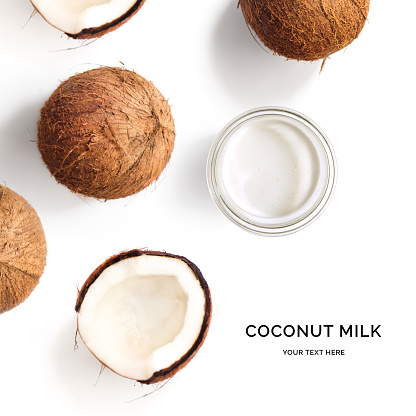 Creative layout made of coconut and coconut milk on white background. Flat lay. Food concept. Macro  concept.