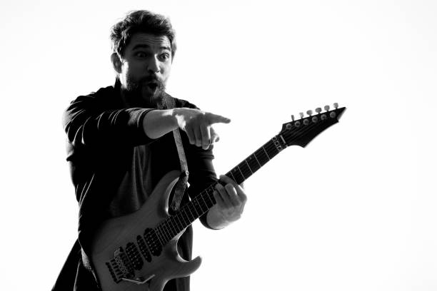 istock Musician with guitar rock star emotions entertainment modern performer 2104455883